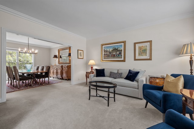 living room with ornamental molding, a chandelier, and light colored carpet