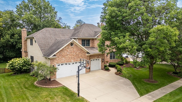 view of front of property with a garage and a front lawn