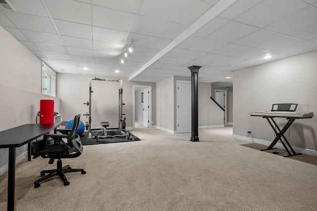 workout area with carpet floors and rail lighting