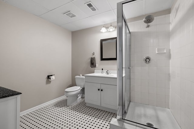 bathroom with an enclosed shower, vanity, and toilet