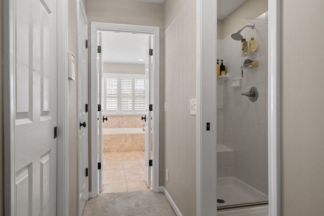 bathroom featuring tile patterned flooring and an enclosed shower