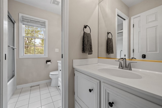 full bathroom with tile patterned floors, vanity, toilet, and combined bath / shower with glass door