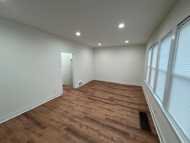 empty room with dark hardwood / wood-style floors