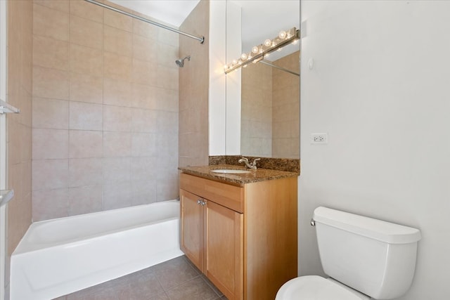 full bathroom with tile patterned floors, vanity, toilet, and tiled shower / bath