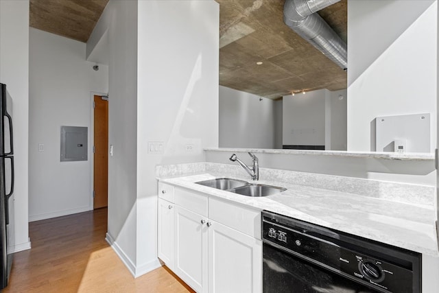 kitchen with sink, light hardwood / wood-style flooring, electric panel, white cabinets, and black appliances