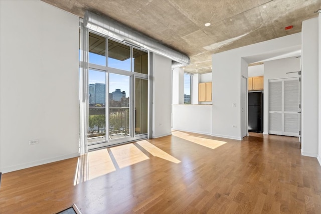 spare room with hardwood / wood-style flooring