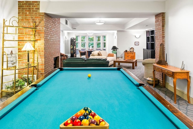 recreation room with carpet, brick wall, and pool table