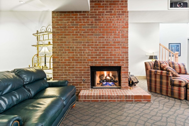 carpeted living room featuring a brick fireplace