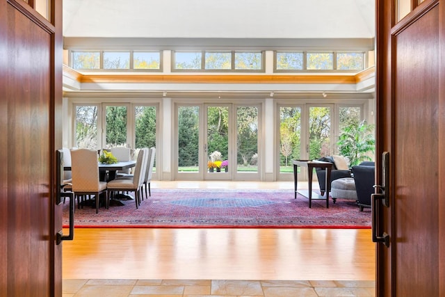 sunroom / solarium with french doors and a healthy amount of sunlight