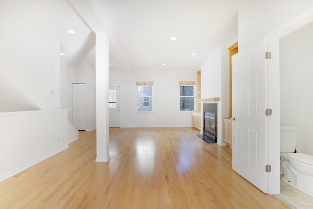 unfurnished living room featuring light hardwood / wood-style flooring