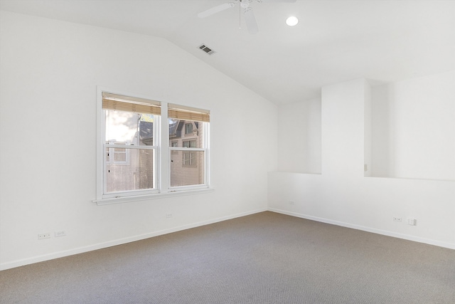 carpeted spare room with lofted ceiling and ceiling fan