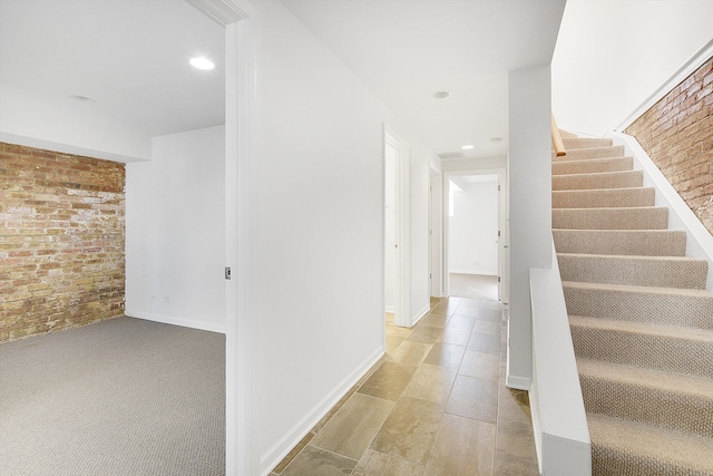 hallway with brick wall