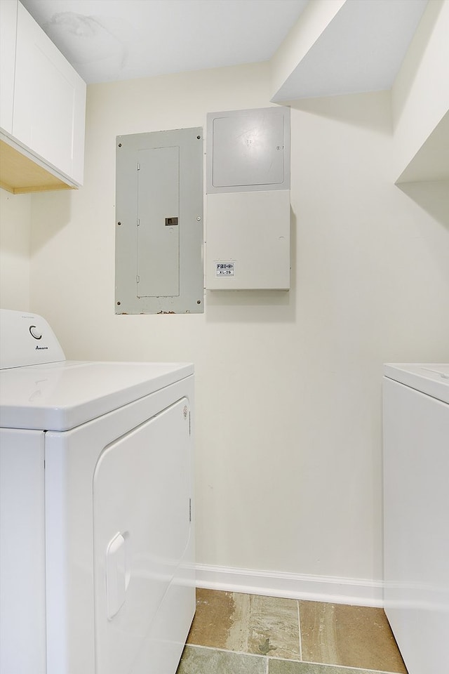 laundry area with cabinets, electric panel, and independent washer and dryer