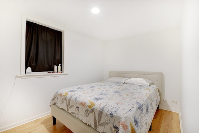 bedroom featuring hardwood / wood-style flooring