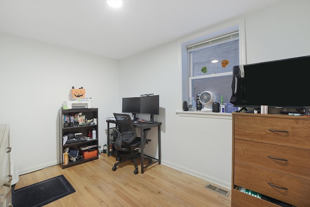 home office with light wood-type flooring