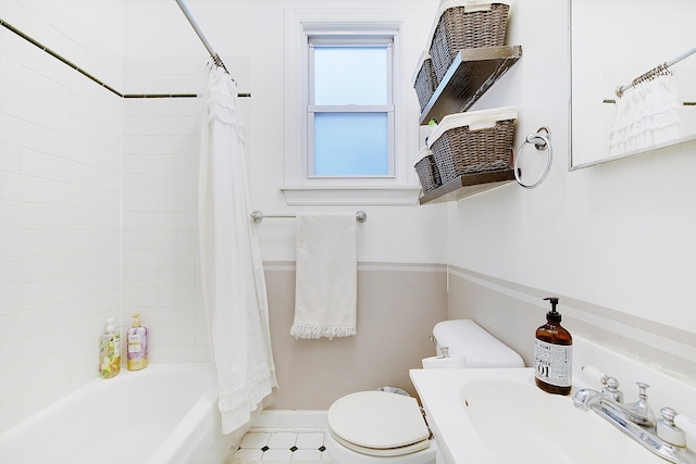 full bathroom featuring shower / bath combo, sink, and toilet