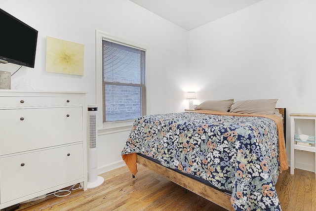 bedroom with light wood-type flooring