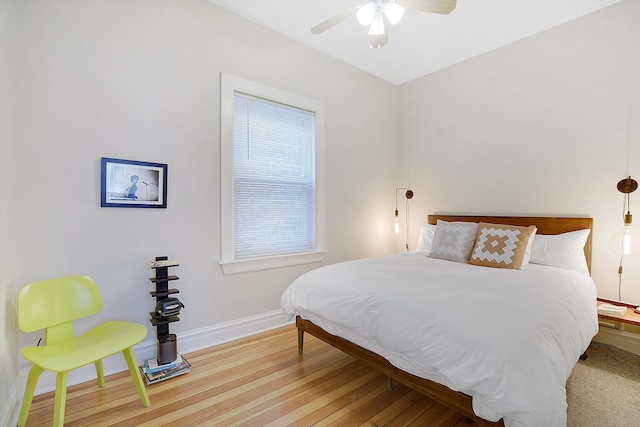 bedroom with wood-type flooring and ceiling fan