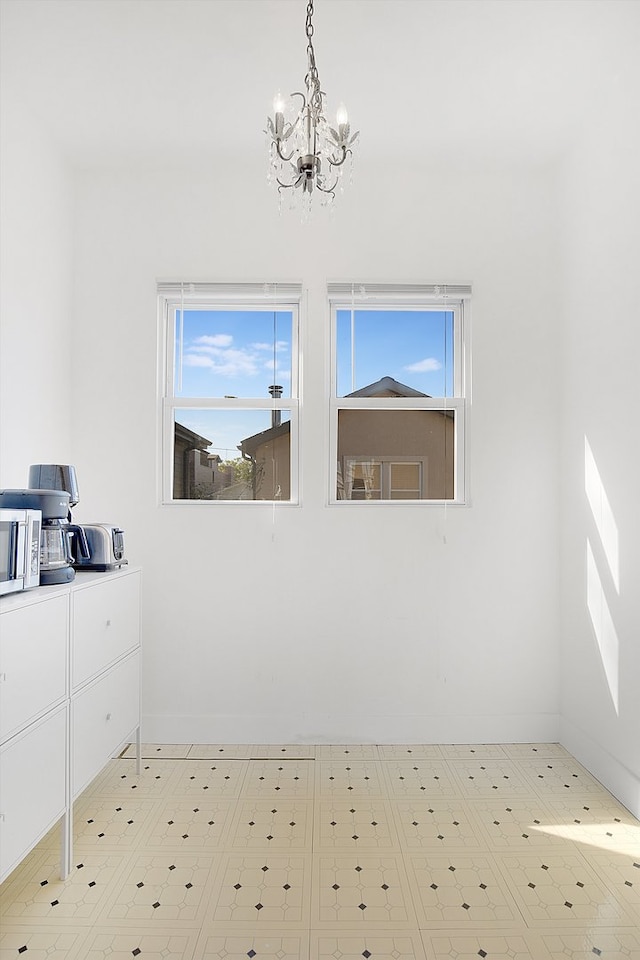 interior space featuring a wealth of natural light and an inviting chandelier