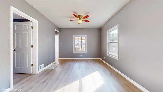 unfurnished room featuring ceiling fan and light hardwood / wood-style flooring