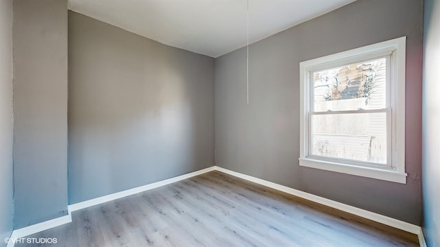 spare room featuring light wood-type flooring