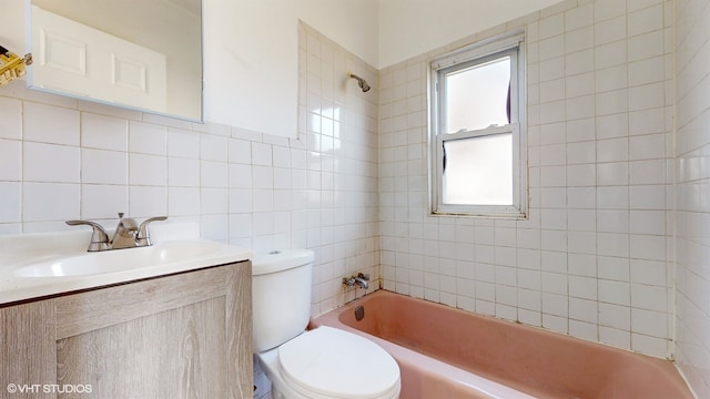 full bathroom with toilet, vanity, tiled shower / bath combo, tile walls, and tasteful backsplash