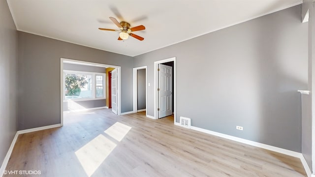 unfurnished room featuring light hardwood / wood-style floors and ceiling fan