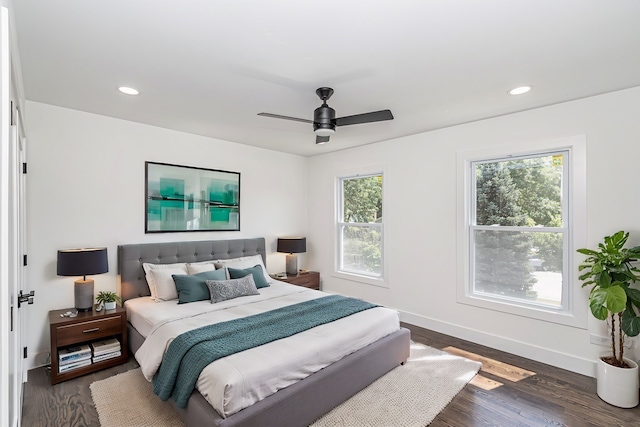 bedroom with wood-type flooring and ceiling fan