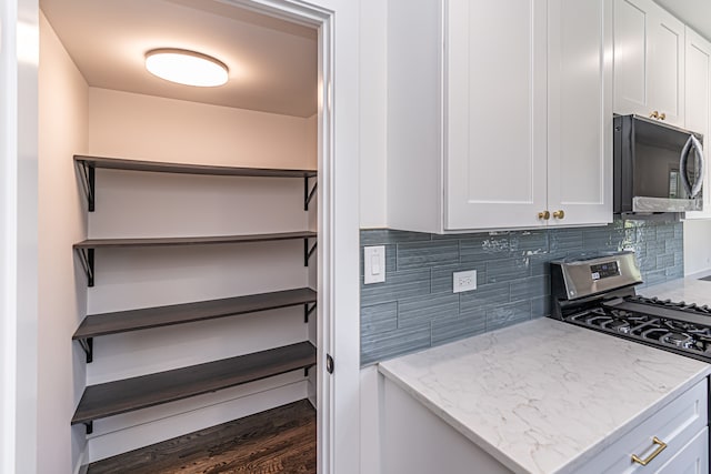 bathroom with toilet, hardwood / wood-style floors, and vanity