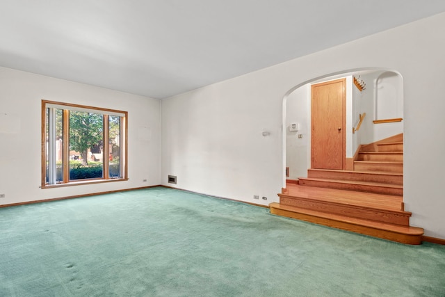 unfurnished room featuring carpet flooring