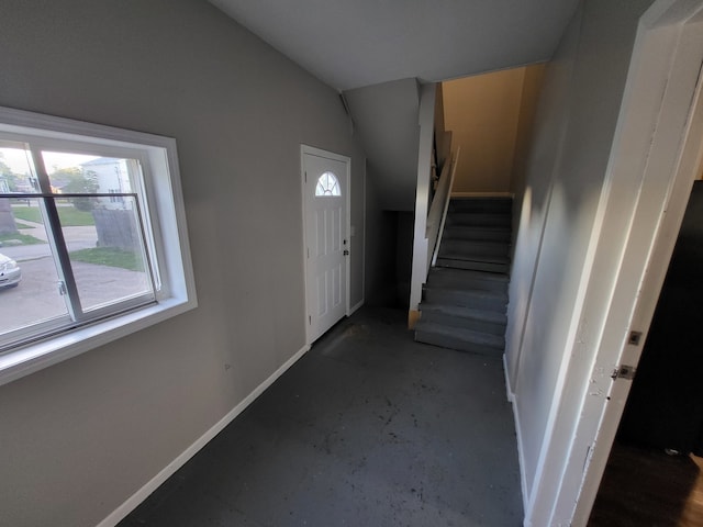 entryway featuring lofted ceiling