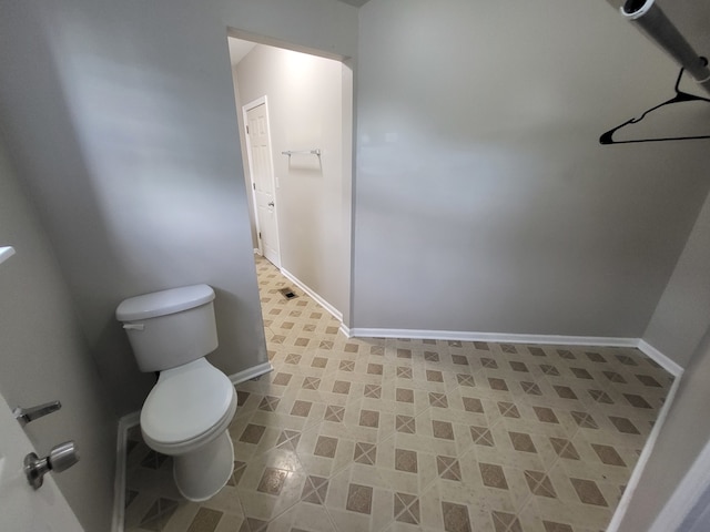 bathroom featuring toilet