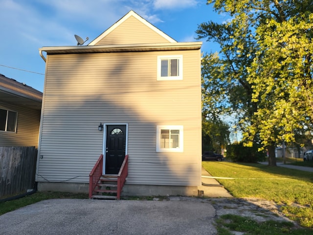 front facade with a front lawn