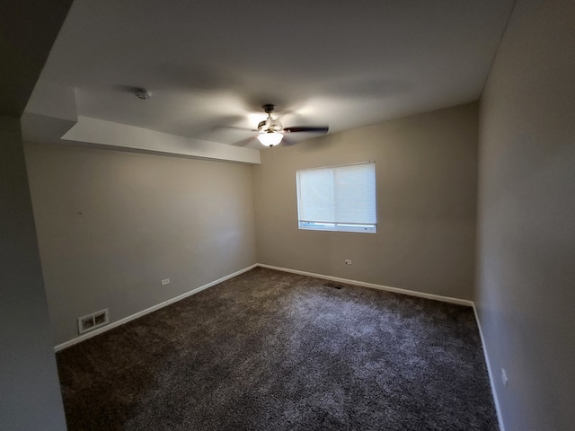 empty room featuring ceiling fan and carpet flooring