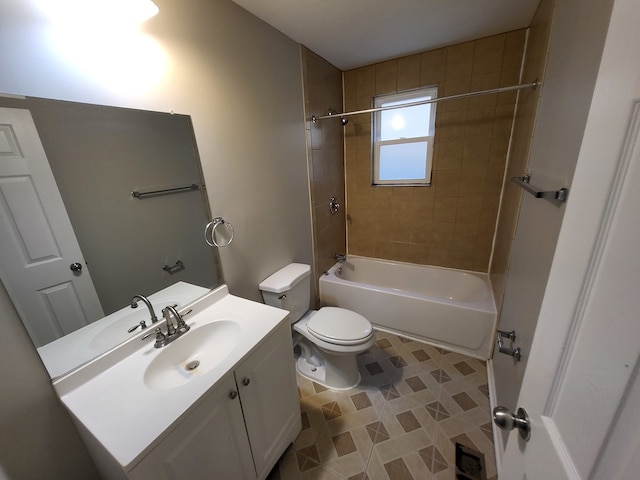 full bathroom featuring tiled shower / bath, vanity, and toilet