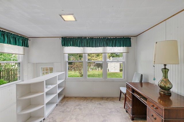 unfurnished office featuring wood walls