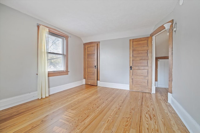 empty room with light hardwood / wood-style floors