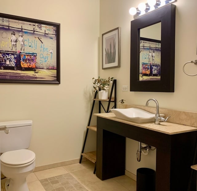 bathroom featuring tile patterned floors, sink, and toilet