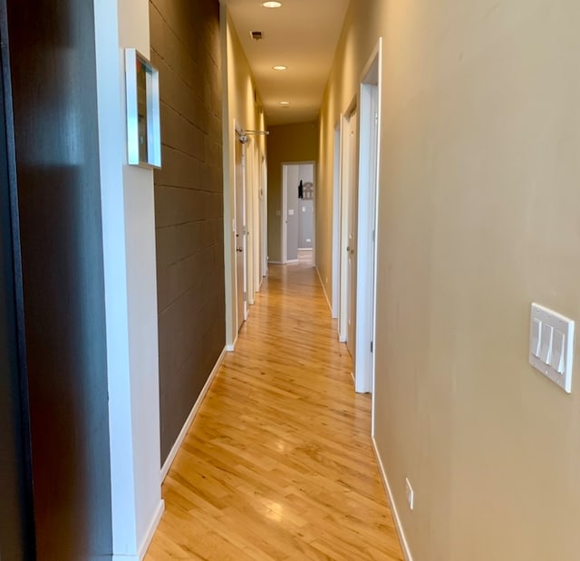 hall with light hardwood / wood-style floors