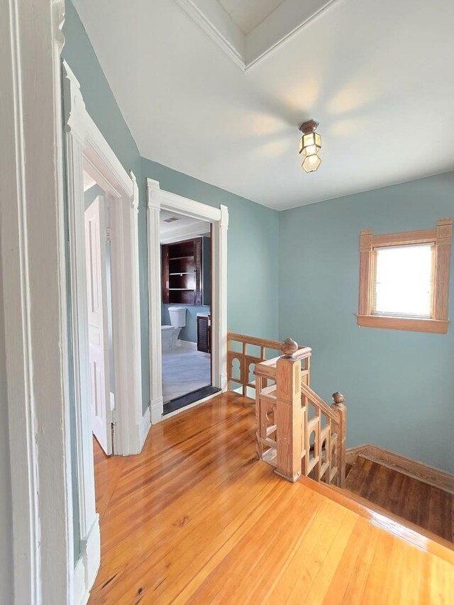 702 Franklin St, Waukegan, IL 60085 - spare room with wood finished floors and baseboards