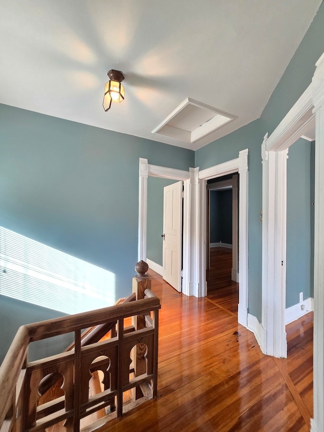 corridor featuring hardwood / wood-style floors