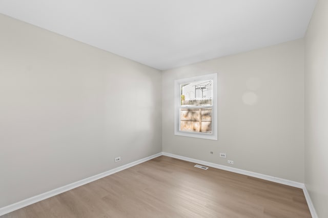 spare room featuring light wood-type flooring