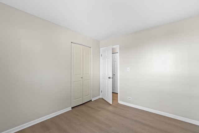 unfurnished bedroom with light hardwood / wood-style floors