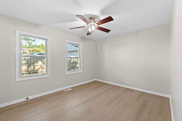 unfurnished room with ceiling fan and light hardwood / wood-style flooring