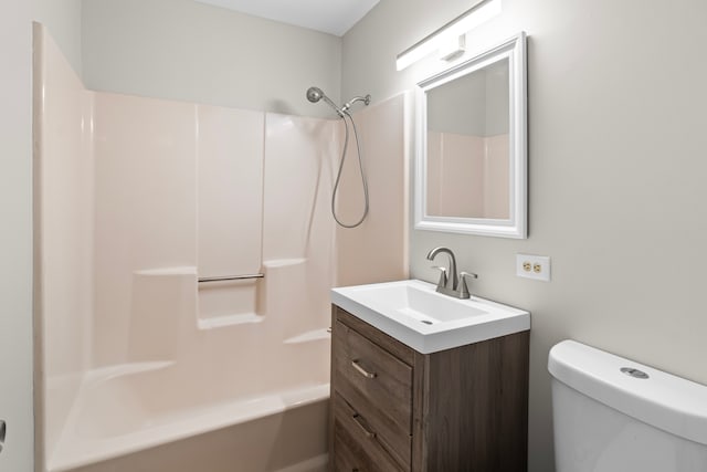 full bathroom featuring vanity, toilet, and washtub / shower combination