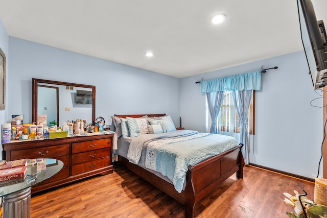 bedroom with light wood-type flooring