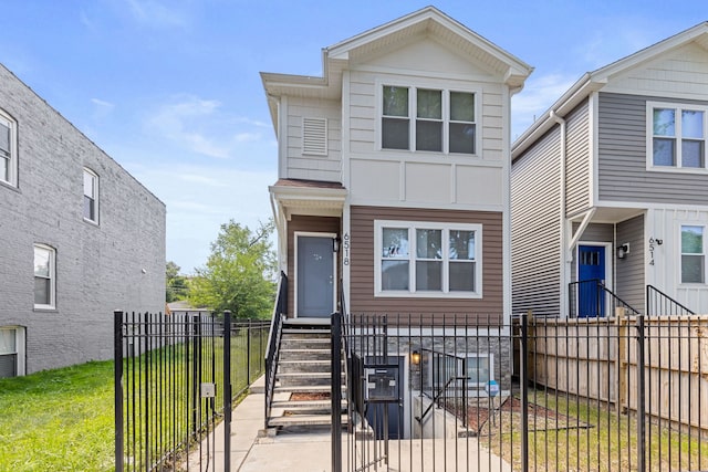 view of front facade featuring a front yard and a fenced front yard