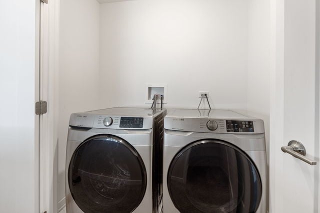 laundry room featuring separate washer and dryer