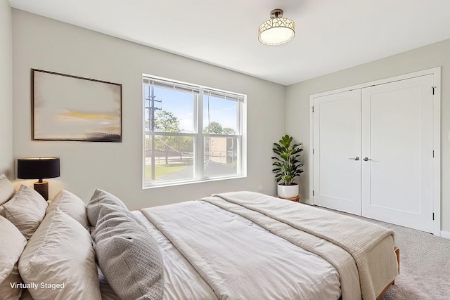 carpeted bedroom with a closet