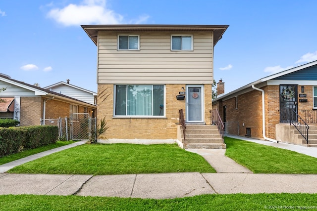 front facade with a front yard